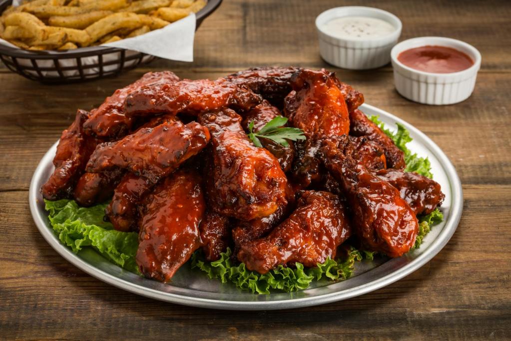 delicious bbq chicken wings with dipping sauces